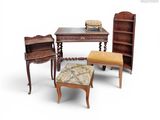 several pieces of furniture including a table, chair, and bookcase