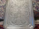 an ornate silver tray on a couch in a room