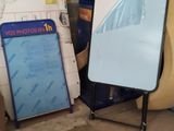a mirror sitting on top of a table next to a pile of boxes