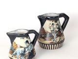 pair of japanese style pottery pitchers with painted figures