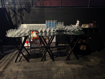 a table with a lot of empty glasses on it