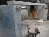 an image of a machine that is working on a piece of metal