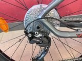 a close up of a bike that is parked on the sidewalk