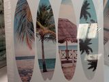 three surfboards that are sitting on a table