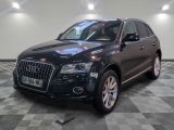 an image of a black audi suv parked in a garage