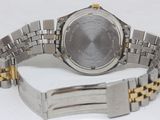 an image of a wrist watch with a gold and silver bracelet