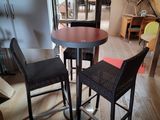 a small table and two chairs in a room