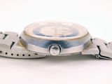 a close up of a wrist watch on a white surface