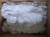 a cardboard box with a lot of clothes inside of it