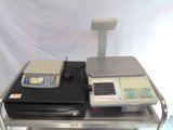 a picture of a scale on a table with a laptop on it