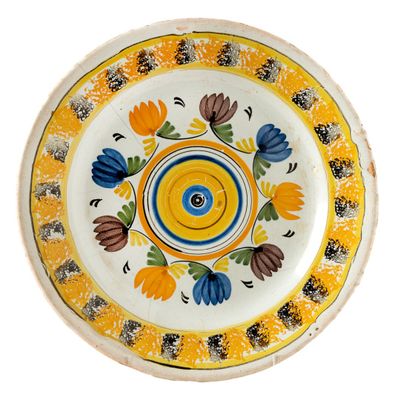 a yellow plate with blue and yellow flowers on it