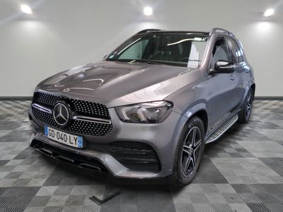 the mercedes gle suv is parked on a checkered floor