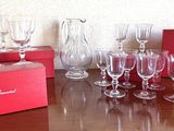 many wine glasses sitting on a table with a red box