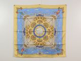 an image of a blue and yellow scarf hanging on a wall