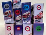 many boxes of different types of firetrucks stacked on top of each other