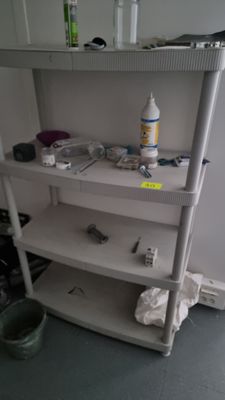 a shelf that has a lot of items on it
