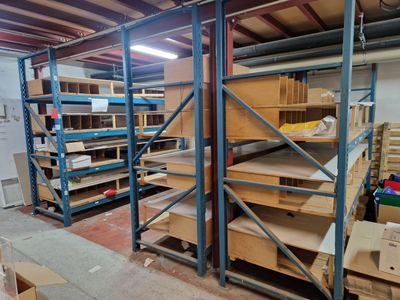 a room with a lot of shelves and boxes in it