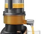 a blender with a glass of orange juice next to it