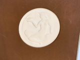 a white plate with a picture of a horse on it