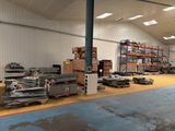 a large warehouse filled with lots of different types of equipment