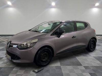 the grey car is parked on a checkered floor in the garage