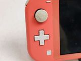 a close up of a pink nintendo wii game console