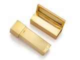 two gold colored lipstick cases sitting next to each other on a white surface