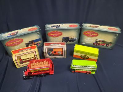 five toy cars and a train in a box