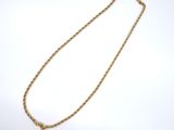 a gold rope necklace with a gold clasp on a white background