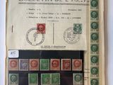 a close up of a book with stamps on it on a table