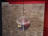 a disco ball hanging from the ceiling in a room
