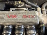 an image of a close up of a v8 engine with the word v8 written on it