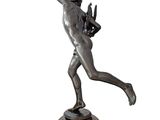 bronze statue of a man holding a bird on a wooden base