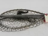 a fishing net and a pair of scissors on the ground