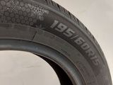 a close up of a tire on a white surface