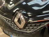 a close up of a car ' s front grill with a logo on it