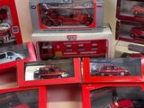 a lot of red and white toy cars in boxes