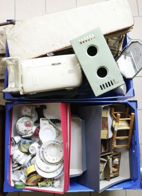 a lot of junk in a blue bin on the floor