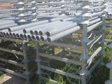 a lot of pipes that are sitting in the grass