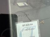 a sticker on the windshield of a car with a sticker on it