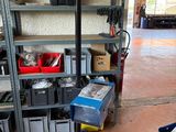 a garage with a lot of tools on the shelves