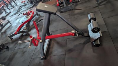 an image of a gym room with a bench and exercise equipment