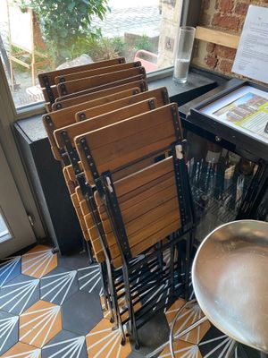 a lot of chairs and a table in a room