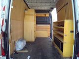 a van that has a bunch of shelves inside of it