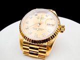 yellow gold rolex watch with diamonds on the bezel