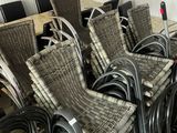 many chairs and tables in a room with a table and chairs