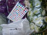 a bag of purple and white yarn next to a bag of purple and white yarn