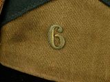 an image of a close up of a bag with a gold letter on it