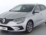 a silver car is parked in a white room