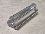 two clear tubes sitting on a wooden surface